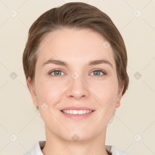 Joyful white young-adult female with short  brown hair and grey eyes