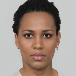 Neutral black young-adult female with short  black hair and brown eyes