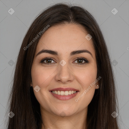 Joyful white young-adult female with long  brown hair and brown eyes