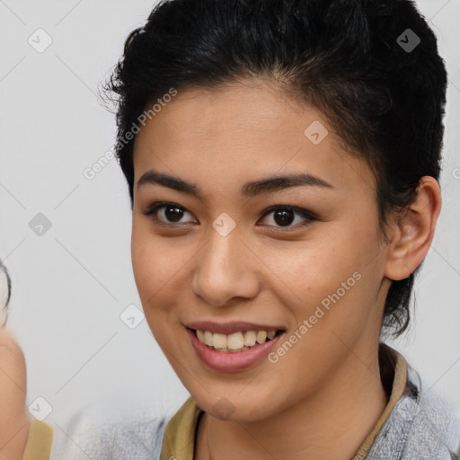 Joyful latino young-adult female with short  brown hair and brown eyes