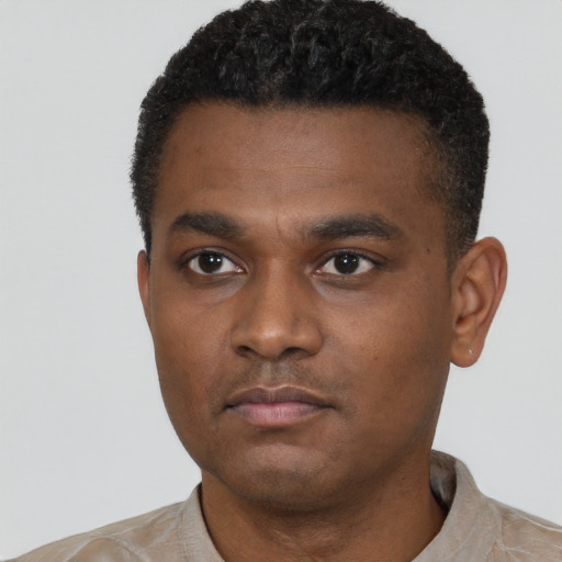 Neutral black young-adult male with short  black hair and brown eyes