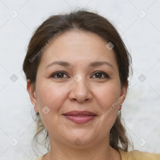 Joyful white adult female with medium  brown hair and brown eyes