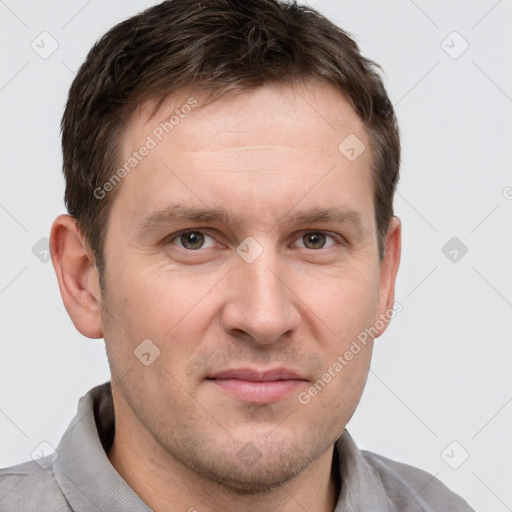 Joyful white adult male with short  brown hair and grey eyes