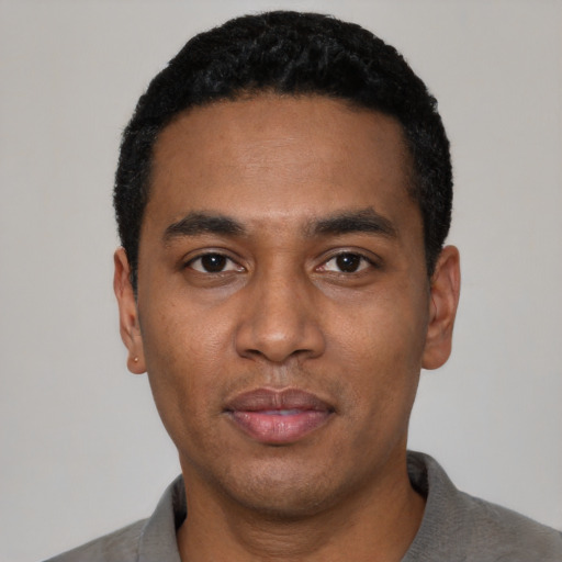 Neutral black young-adult male with short  black hair and brown eyes