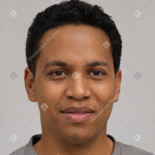 Joyful black young-adult male with short  black hair and brown eyes