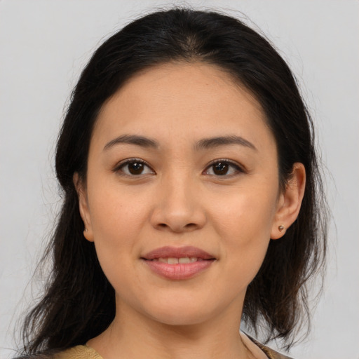 Joyful asian young-adult female with medium  brown hair and brown eyes