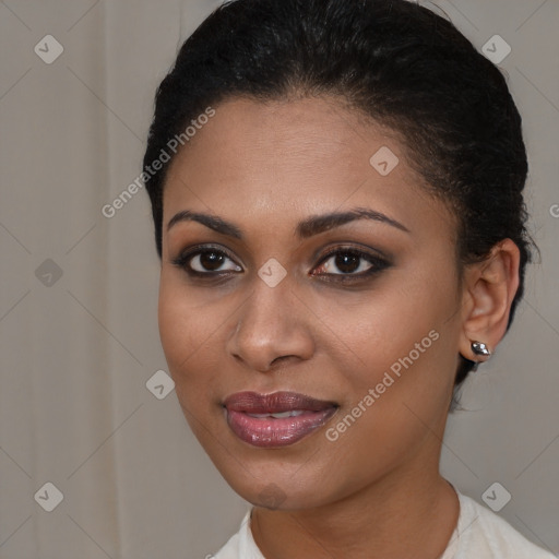 Joyful black young-adult female with short  brown hair and brown eyes