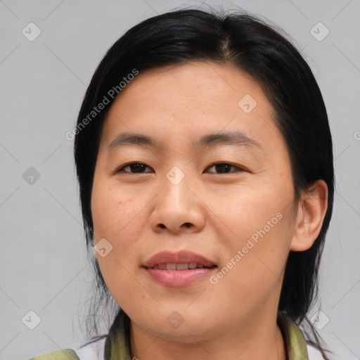 Joyful asian young-adult female with medium  brown hair and brown eyes