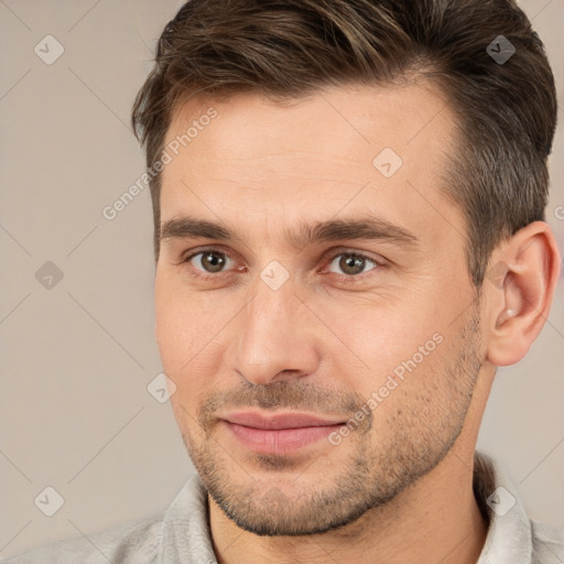 Joyful white adult male with short  brown hair and brown eyes