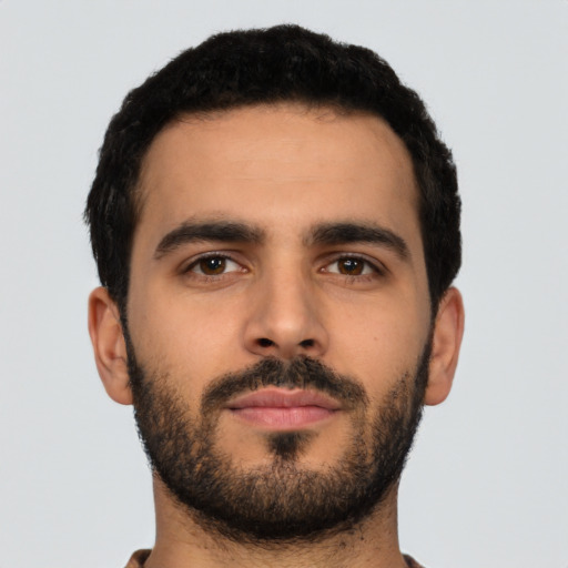 Neutral latino young-adult male with short  black hair and brown eyes
