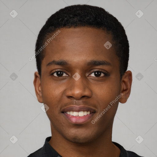 Joyful black young-adult male with short  black hair and brown eyes