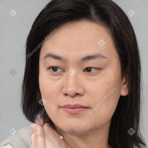 Joyful asian young-adult female with medium  brown hair and brown eyes