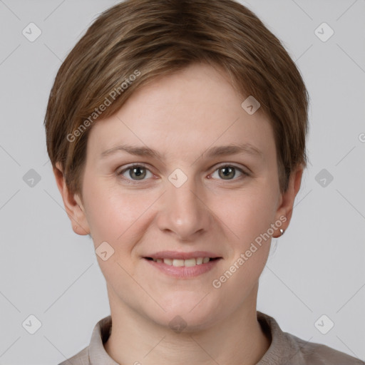 Joyful white young-adult female with short  brown hair and grey eyes