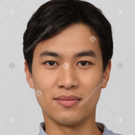 Joyful asian young-adult male with short  black hair and brown eyes