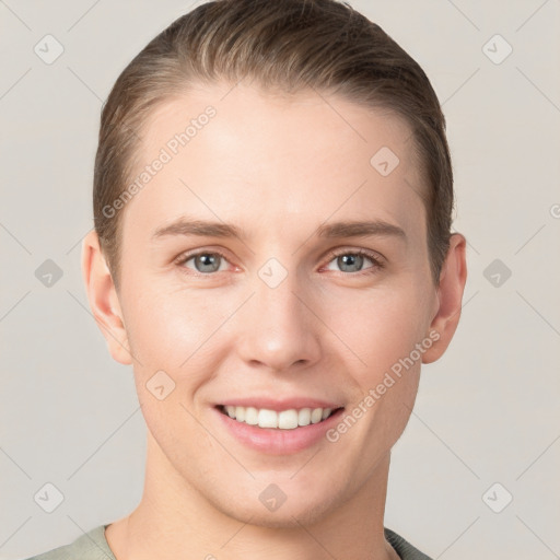 Joyful white young-adult female with short  brown hair and grey eyes