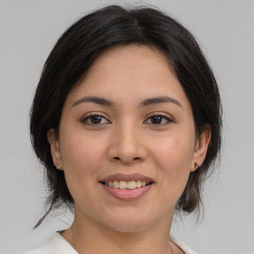 Joyful asian young-adult female with medium  brown hair and brown eyes