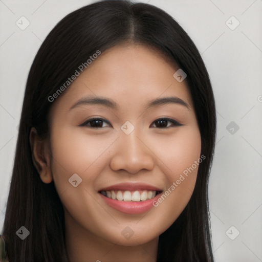 Joyful latino young-adult female with long  black hair and brown eyes