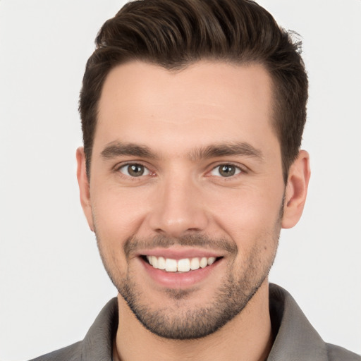 Joyful white young-adult male with short  brown hair and brown eyes