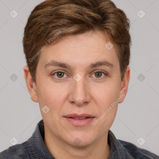 Joyful white adult male with short  brown hair and grey eyes