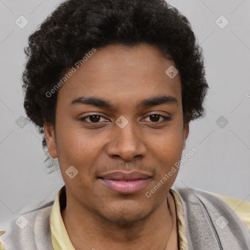 Joyful black young-adult male with short  brown hair and brown eyes