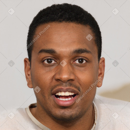 Joyful black young-adult male with short  black hair and brown eyes