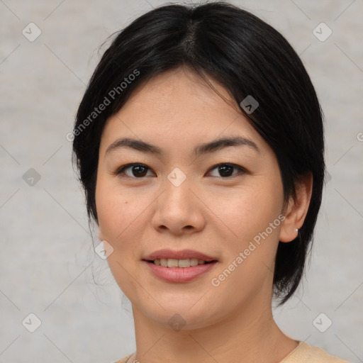 Joyful asian young-adult female with medium  black hair and brown eyes