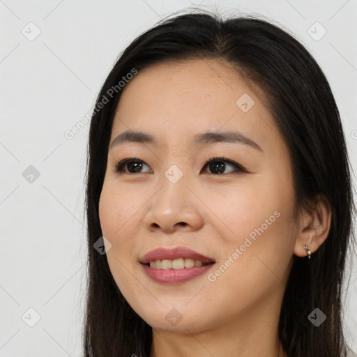 Joyful asian young-adult female with long  brown hair and brown eyes