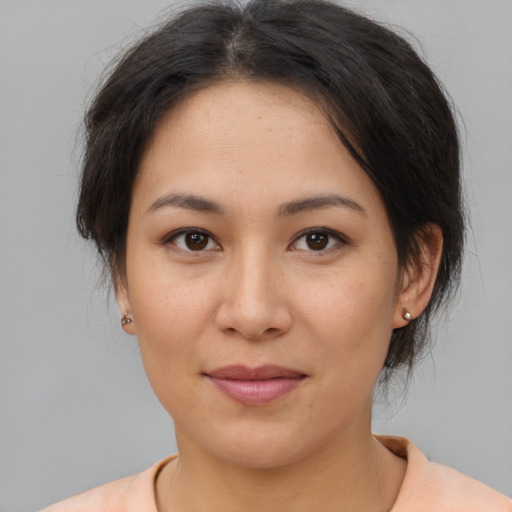 Joyful asian young-adult female with medium  brown hair and brown eyes