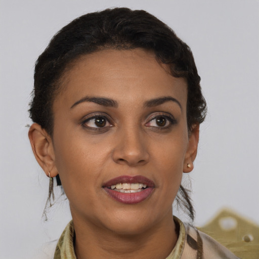 Joyful latino young-adult female with short  brown hair and brown eyes