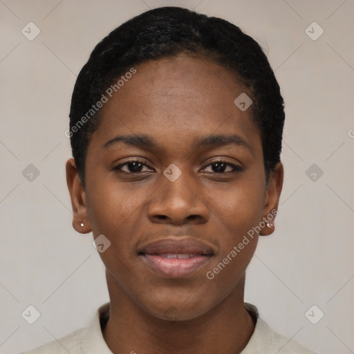 Joyful black young-adult female with short  black hair and brown eyes