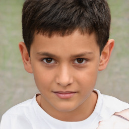 Joyful white child male with short  brown hair and brown eyes