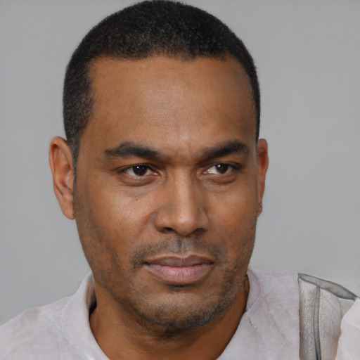 Neutral latino adult male with short  black hair and brown eyes