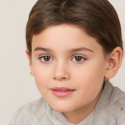 Joyful white child female with short  brown hair and brown eyes