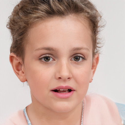 Joyful white child female with short  brown hair and brown eyes