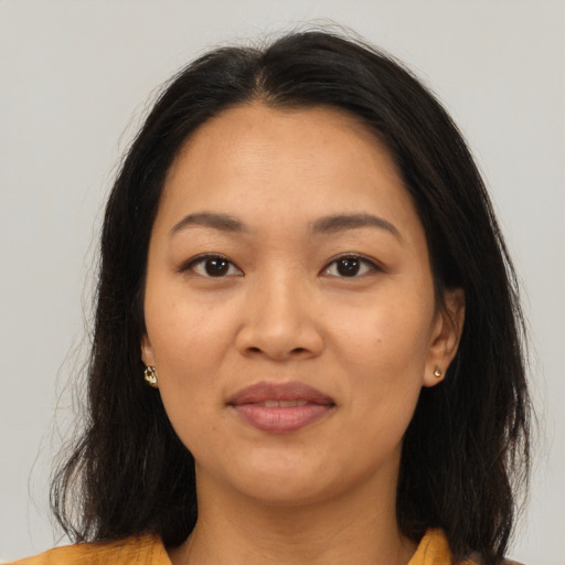 Joyful asian young-adult female with medium  brown hair and brown eyes