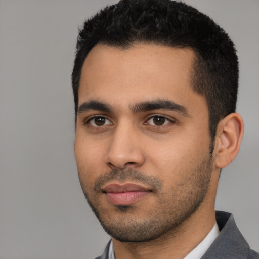 Neutral latino young-adult male with short  black hair and brown eyes