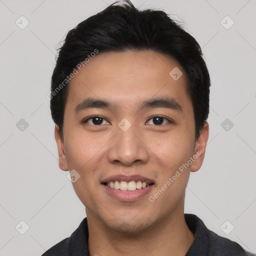 Joyful asian young-adult male with short  black hair and brown eyes