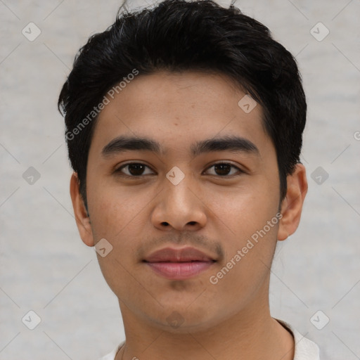 Joyful asian young-adult male with short  black hair and brown eyes