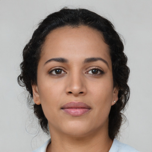 Neutral latino young-adult female with medium  brown hair and brown eyes