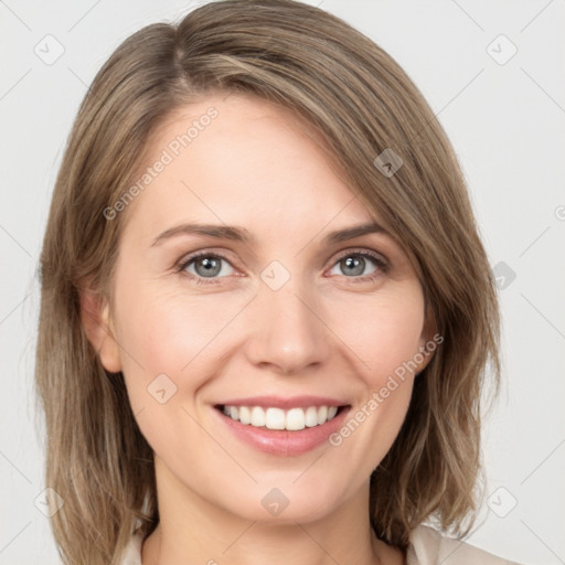 Joyful white young-adult female with medium  brown hair and green eyes