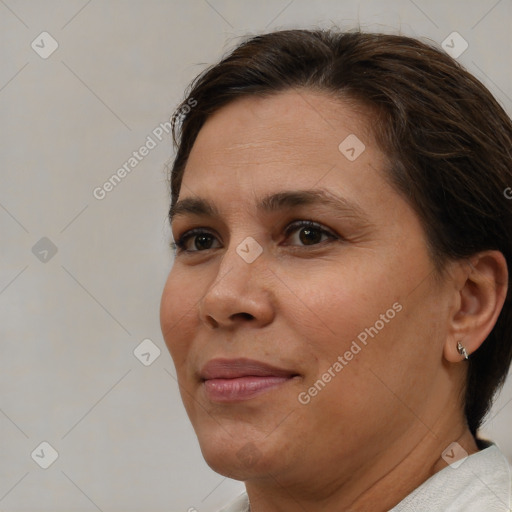 Joyful white adult female with short  brown hair and brown eyes