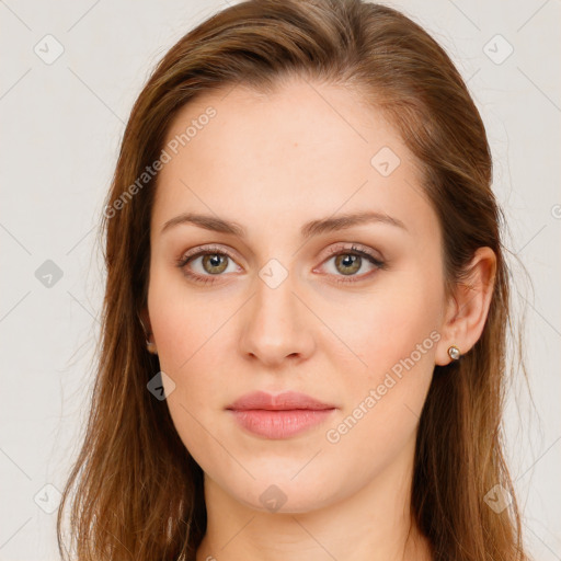 Joyful white young-adult female with long  brown hair and green eyes