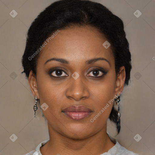 Joyful black young-adult female with short  brown hair and brown eyes