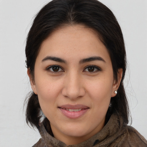 Joyful white young-adult female with medium  brown hair and brown eyes