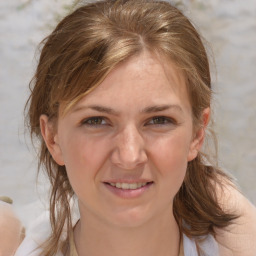 Joyful white adult female with medium  brown hair and grey eyes