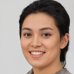 Joyful asian young-adult female with medium  brown hair and brown eyes