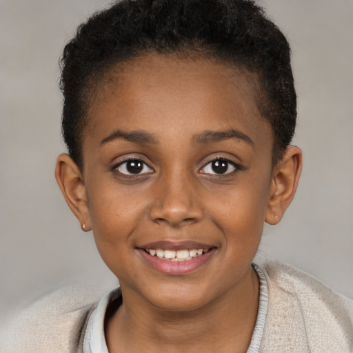 Joyful black child female with short  brown hair and brown eyes