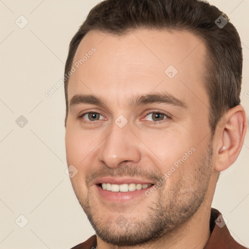 Joyful white young-adult male with short  brown hair and brown eyes