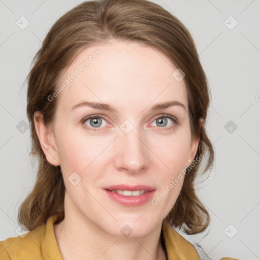 Joyful white young-adult female with medium  brown hair and blue eyes