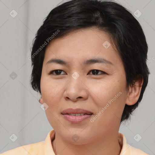 Joyful asian young-adult female with medium  brown hair and brown eyes